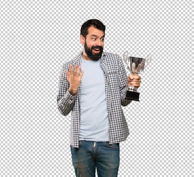 PSD handsome man with beard holding a trophy