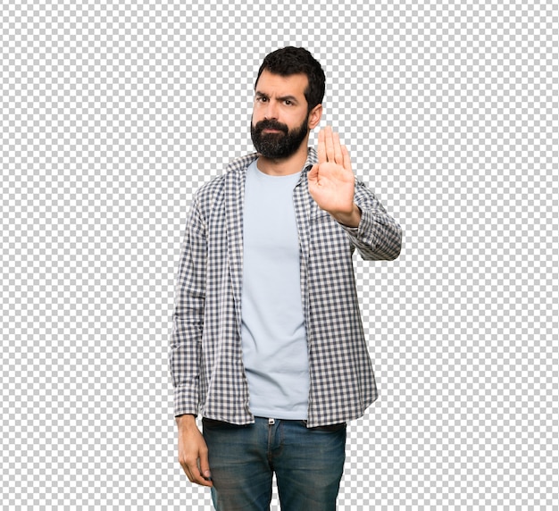 Handsome man with beard making stop gesture