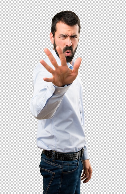 Handsome man with beard making stop sign