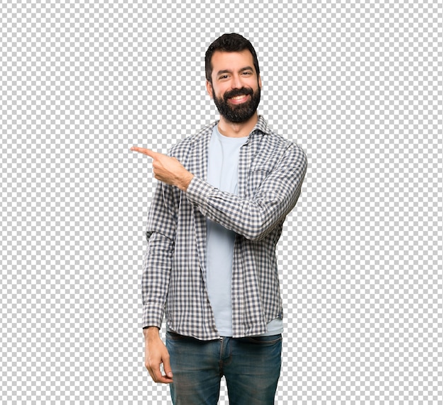 PSD handsome man with beard pointing to the side to present a product