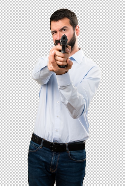 PSD handsome man with beard shooting with a pistol