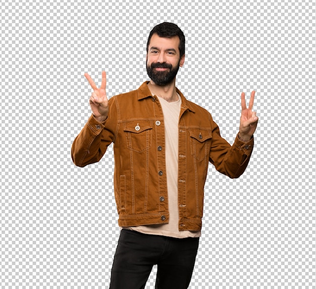 Handsome man with beard showing victory sign with both hands