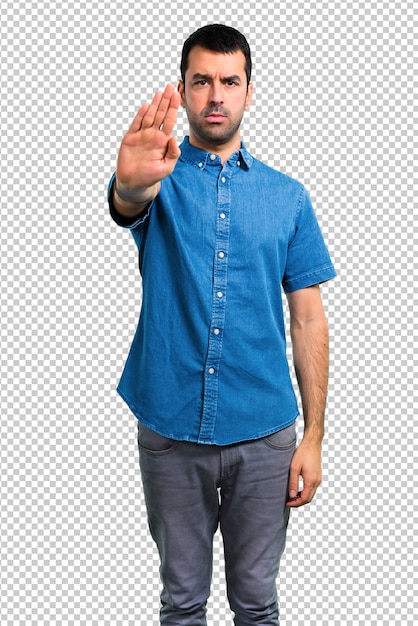 Handsome man with blue shirt making stop gesture with her hand