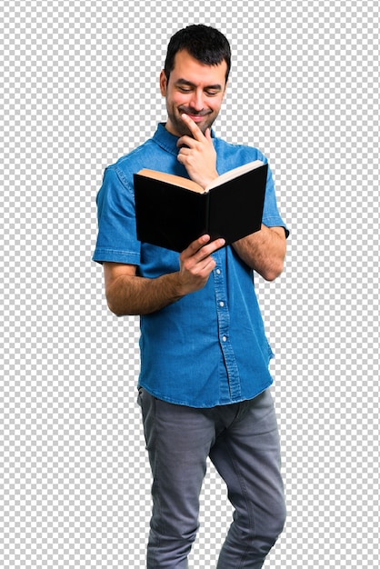 Handsome man with blue shirt reading a book