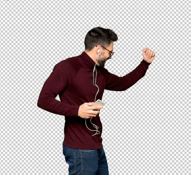 handsome man with glasses listening music with the phone