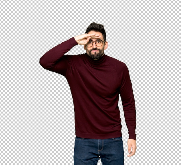 PSD handsome man with glasses looking far away with hand to look something