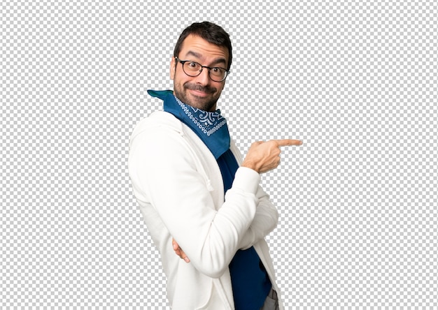 Handsome man with glasses pointing finger to the side in lateral position