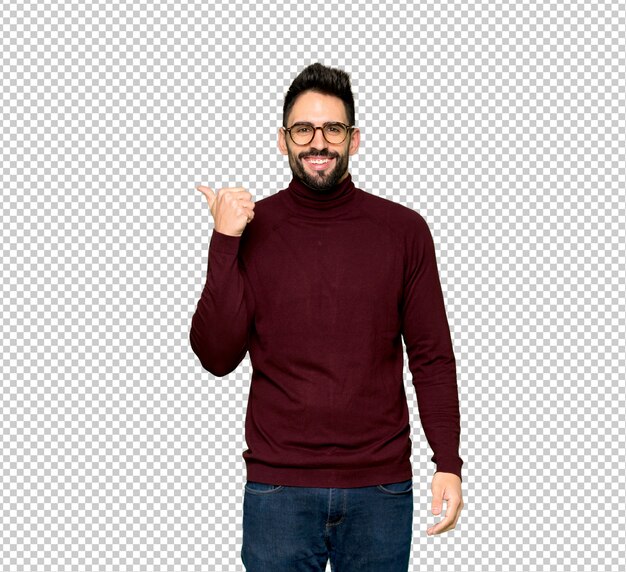 PSD handsome man with glasses pointing to the side to present a product