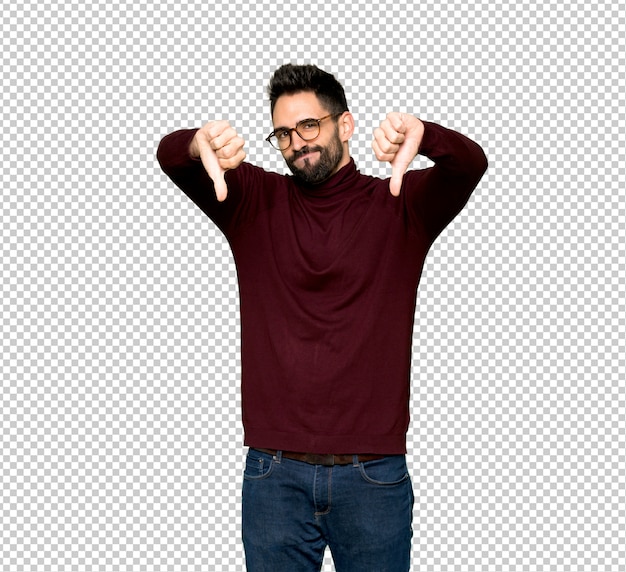 Handsome man with glasses showing thumb down with both hands