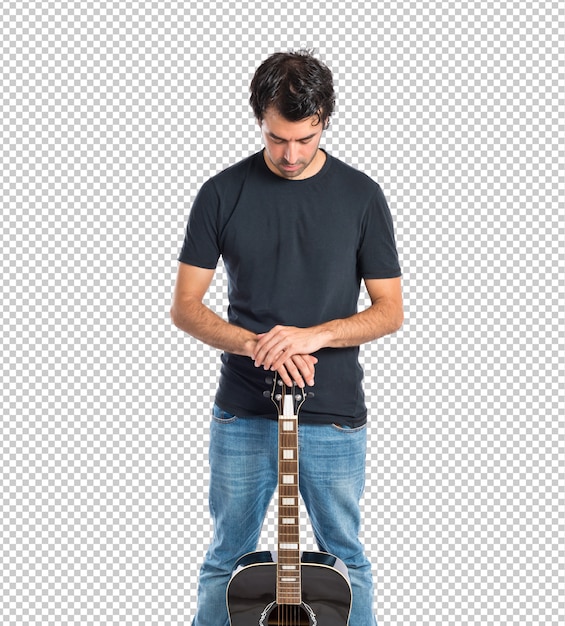 Handsome man with guitar over white background