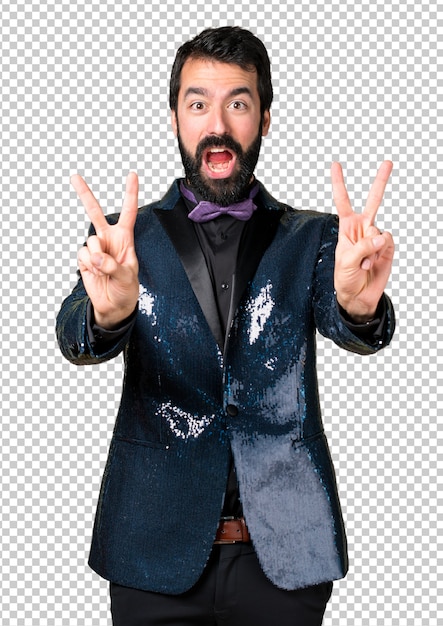 handsome man with sequin jacket making victory gesture