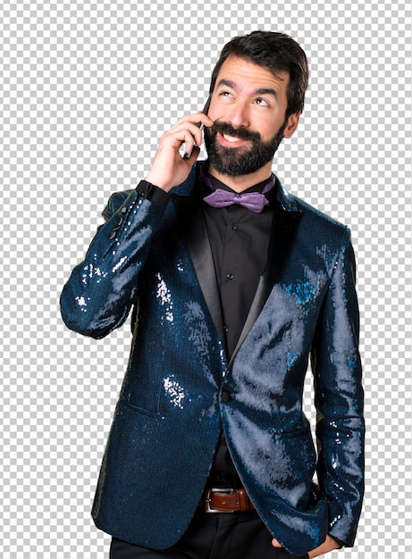 Handsome man with sequin jacket talking to mobile