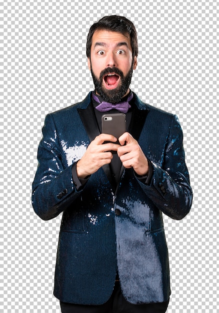 Handsome man with sequin jacket talking to mobile