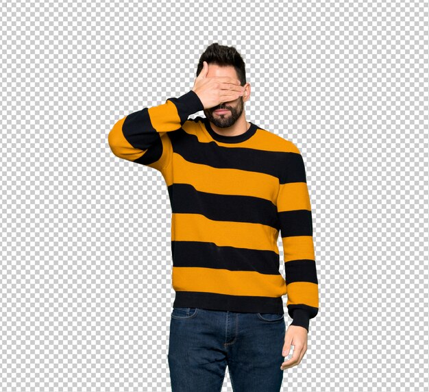 PSD handsome man with striped sweater covering eyes by hands. do not want to see something