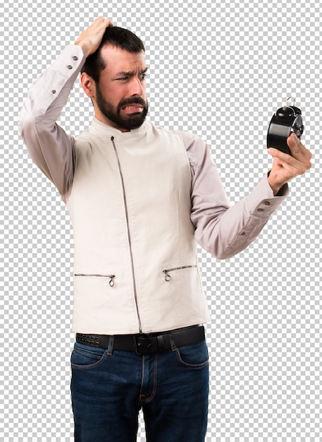 Handsome man with vest holding clock