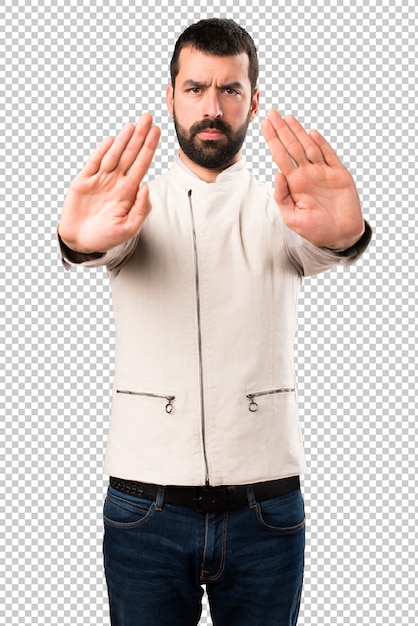 PSD handsome man with vest making stop sign