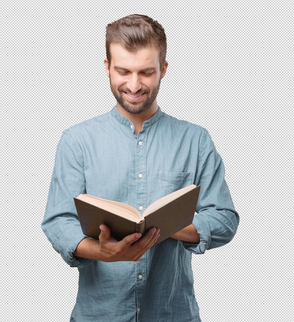 Handsome young man reading in book