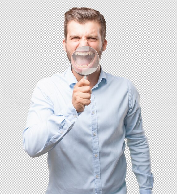 Handsome young man with magnifying glass