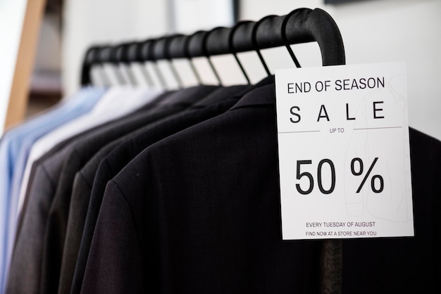 a hanging clothes with sale sign