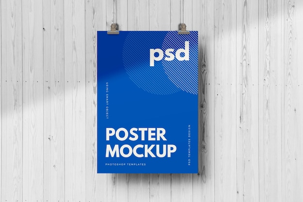 Hanging poster mockup on wall texture background