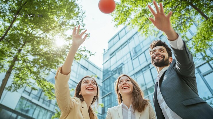 PSD happy business colleagues playing with a ball outdoors