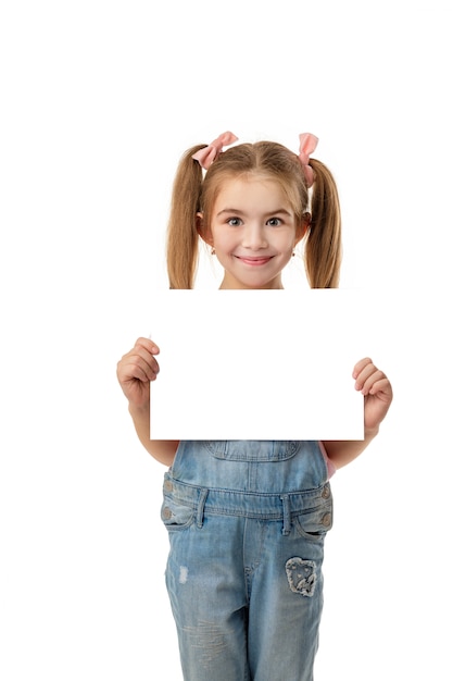 happy cute child girl holding empty blank