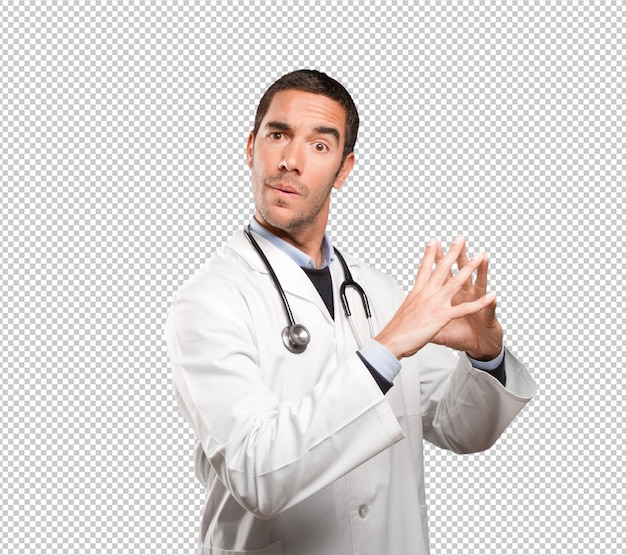 Happy doctor with a concentration gesture