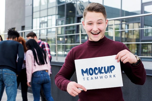 happy man holding teamwork mock-up