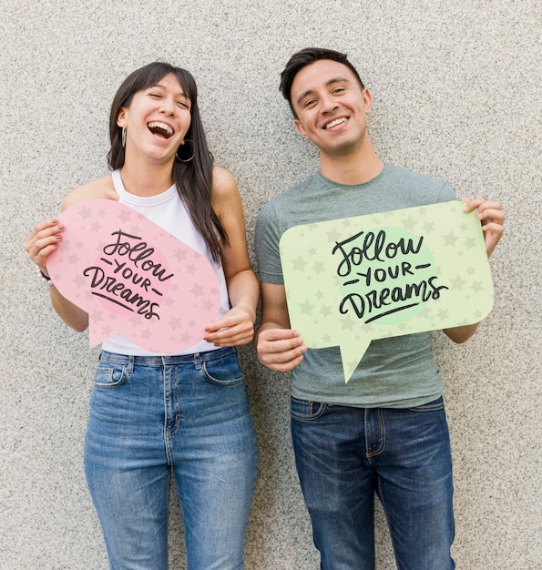 Happy man and woman posing