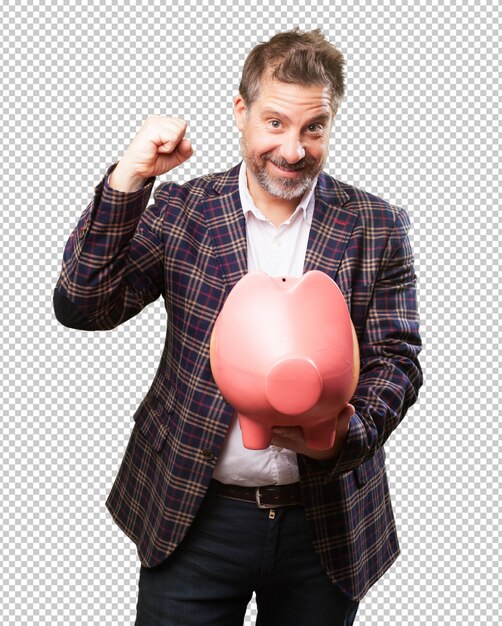 Happy mature man holding a piggy bank