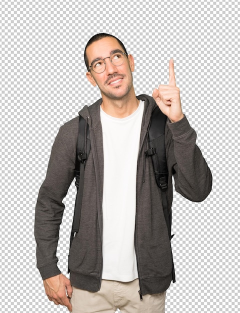 Happy student pointing up with his finger