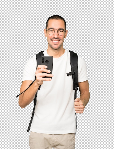 Happy student using his mobile phone