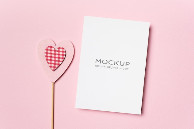 PSD happy valentines day greeting card mockup with heart on pink