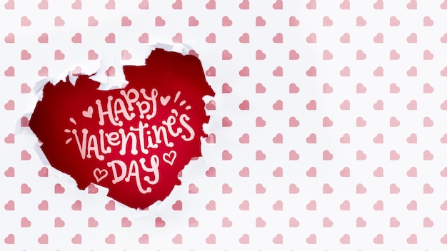 happy valentines day lettering in heart shaped hole