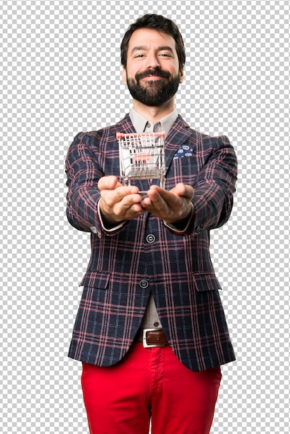 happy well dressed man holding a supermarket cart toy