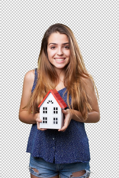 Happy woman showing a house on white