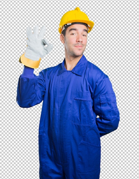 Happy workman doing a gesture of approval on white background