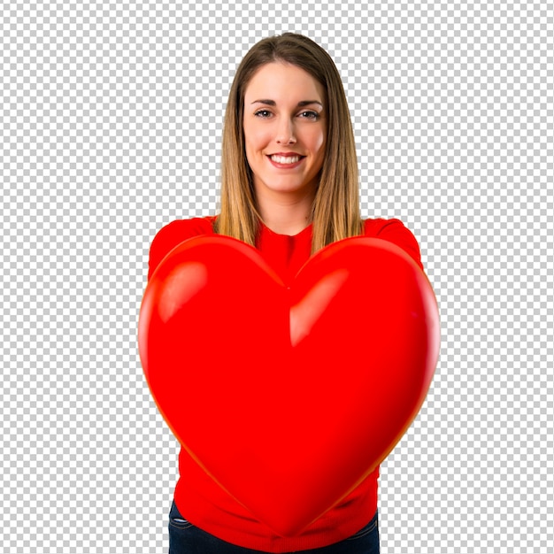 Happy young blonde woman holding a heart icon