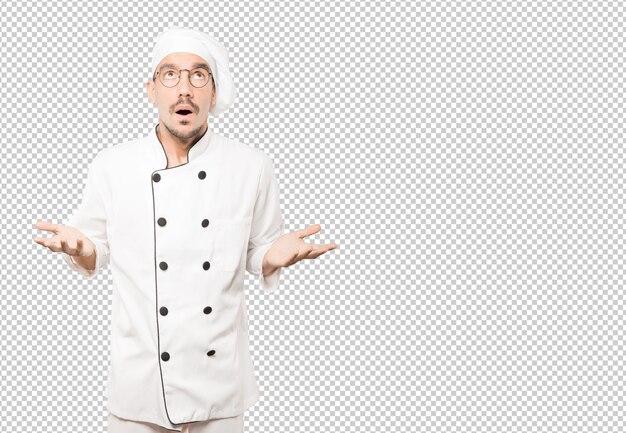 PSD happy young chef looking up gesture