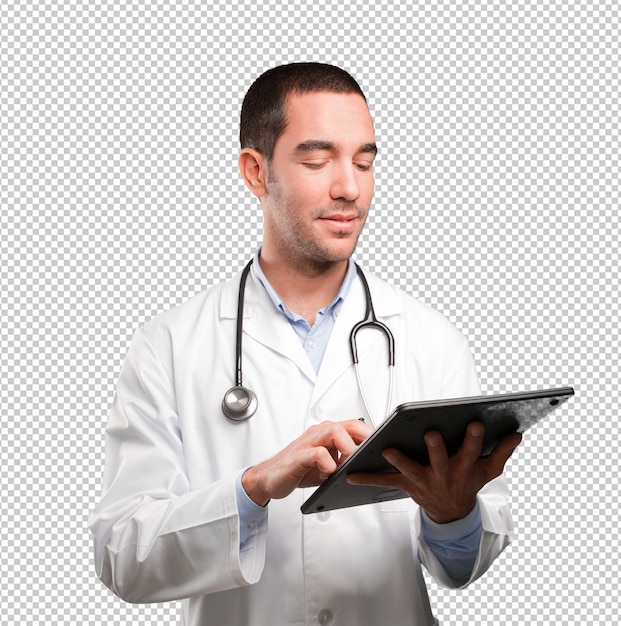 Happy young doctor using a tablet