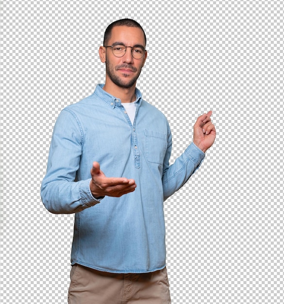 Happy young man doing a gesture of welcome with his hand