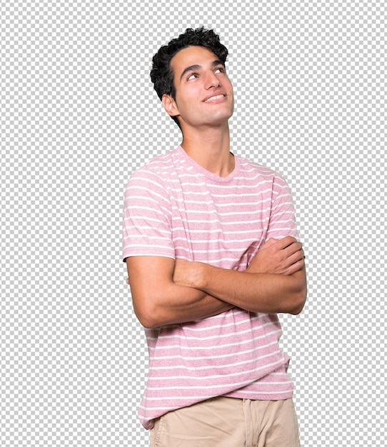 Happy young man looking against background