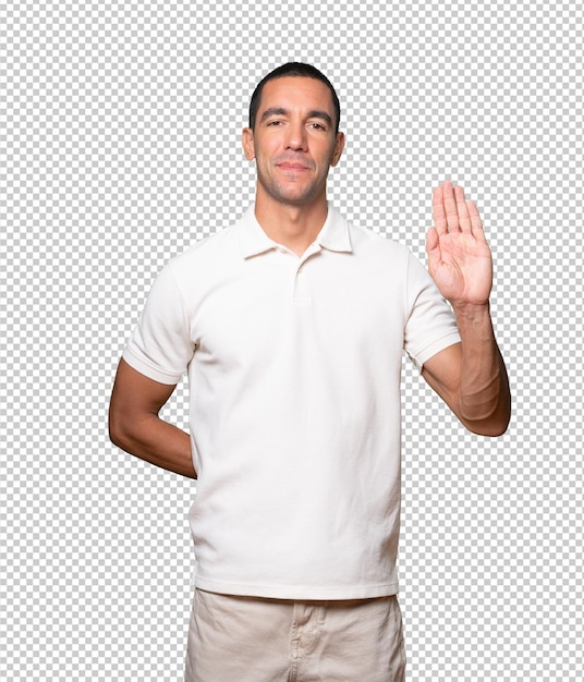 happy young man making a gesture of stop with his palm