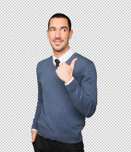 happy young man pointing with his thumb