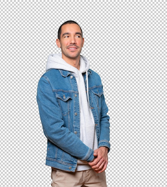 Happy young man posing against background