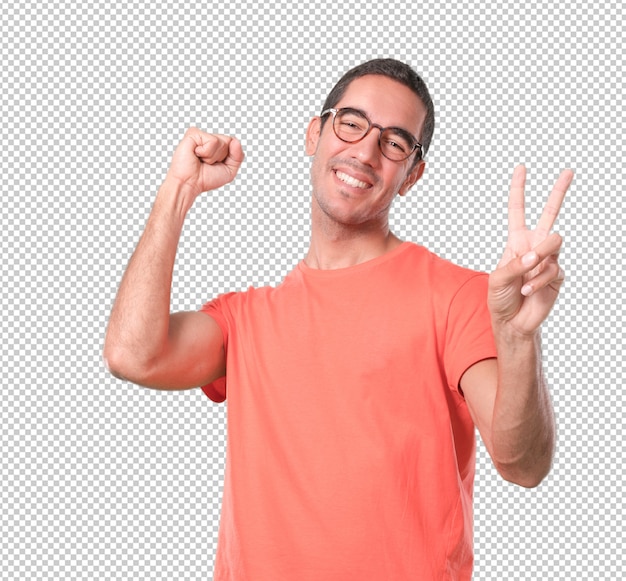 Happy young man with a victory gesture celebrating