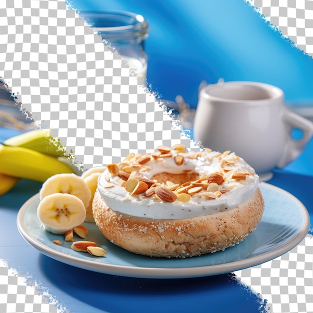 PSD 바나나 와 견과류 를  ⁇ 은 건강 한 베이글 샌드위치 는 투명 한 배경 에 있는 파란색 placemat 에 있는  ⁇ 색 접시 에 요구르트 바나나 와 아몬드 를  ⁇ 어 제공 된다