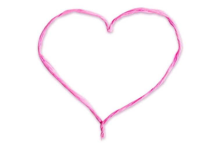 PSD heart made of thin twisted pink paper cut out on a blank background