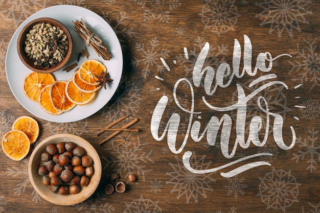 PSD hello winter greeting on wooden background