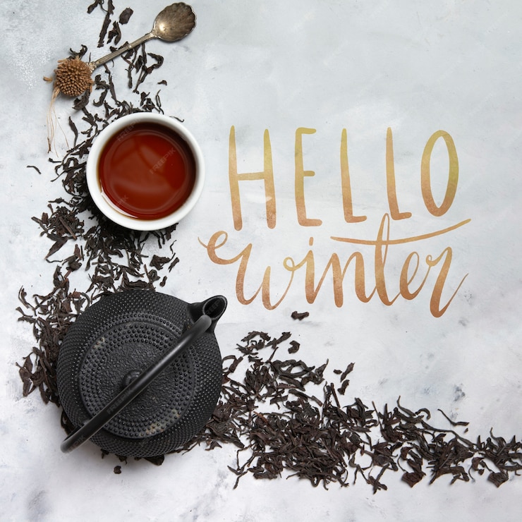  Hello winter message beside kettle with tea